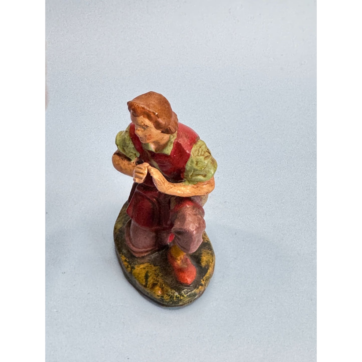 Vintage Italian Paper Mache Figurine Of Kneeling Boy with Horn In Red Outfit