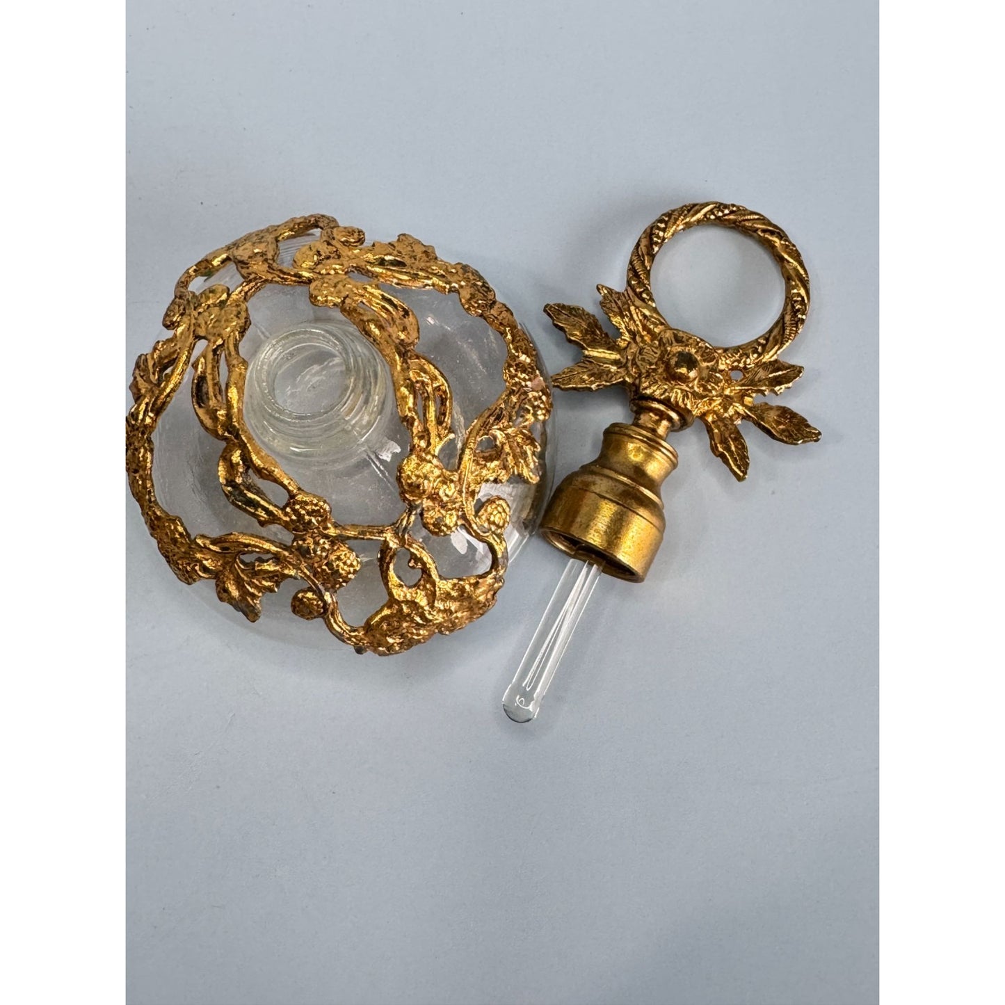 Antique German Gold Gilded Clear Glass Perfume Bottle With Ornate Floral Design & Stopper