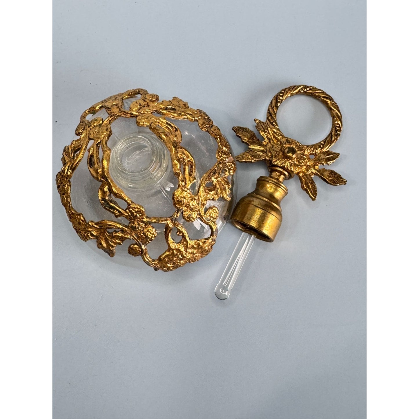 Antique German Gold Gilded Clear Glass Perfume Bottle With Ornate Floral Design & Stopper